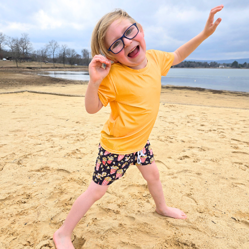 Boy in yellow rash guard