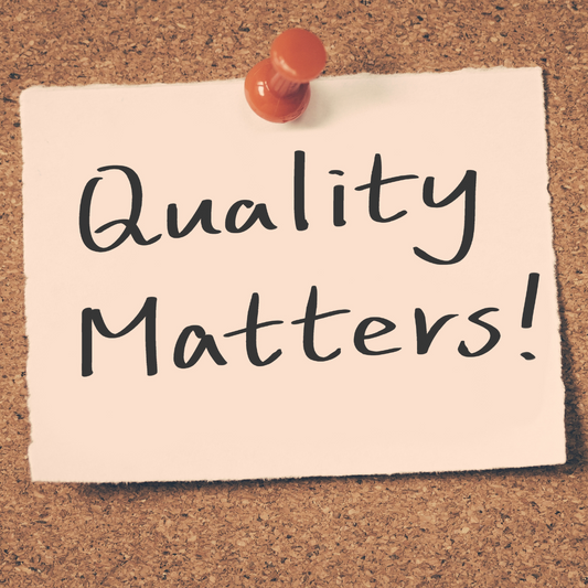 A note pinned on a bulletin board that says "quality matters"