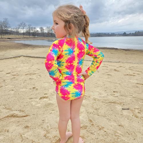 Girl in splatter rash guard 